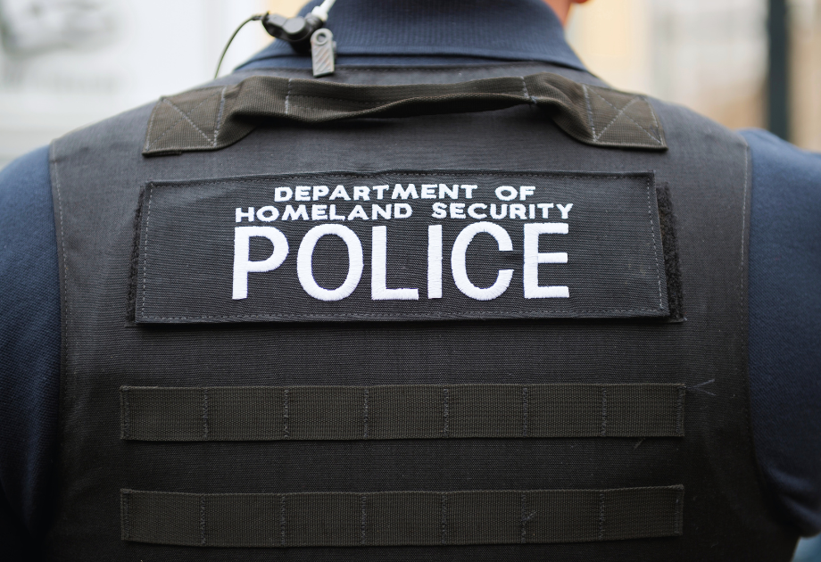 back of a police vest that says, "Department of Homeland Security Police"
